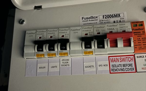 Compact FuseBox F2006MX consumer unit with RCBOs and a surge protection device, installed by AK Electrical