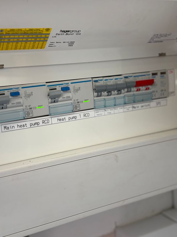 Hager distribution board with labelled heat pump RCDs, immersion heater circuit and main switch, installed by AK Electrical